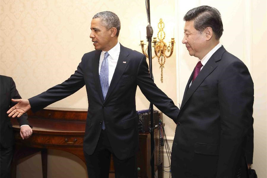 El presidente chino Xi Jinping (derecha) se reúne con el presidente de Estados Unidos Barack Obama en la Haya, Países Bajos, el 24 de marzo de 2014. Xi Jinping se reunió con Barack Obama al margen de la Cumbre de Seguridad Nuclear. [Foto/Xinhua]