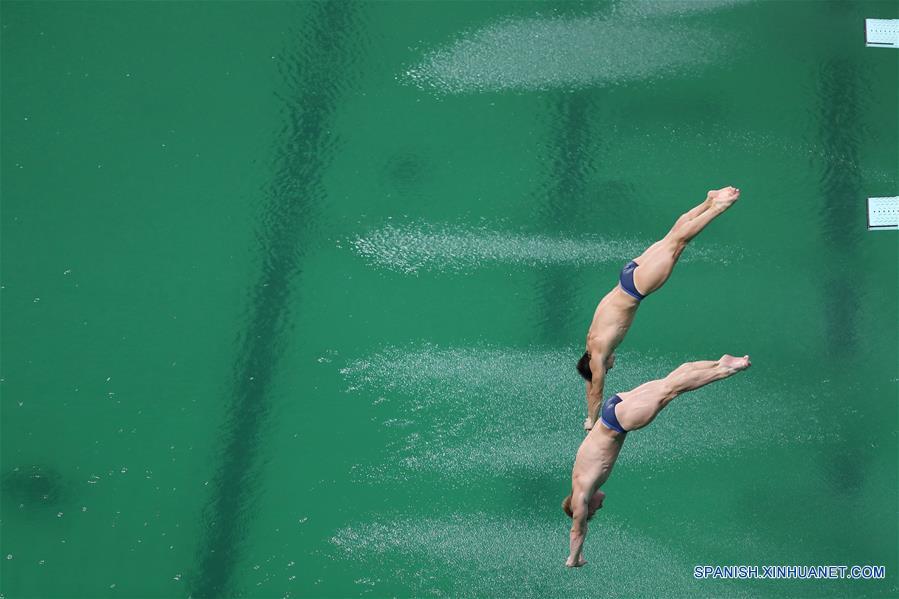 Laugher y Mears terminaron con un total de 454.32 puntos en el Centro Acuático Maria Lenk, apenas 4.11 puntos por arriba de los medallistas de plata Mike Hixon y Sam Dorman de Estados Unidos.(Xinhua/Cao Can)